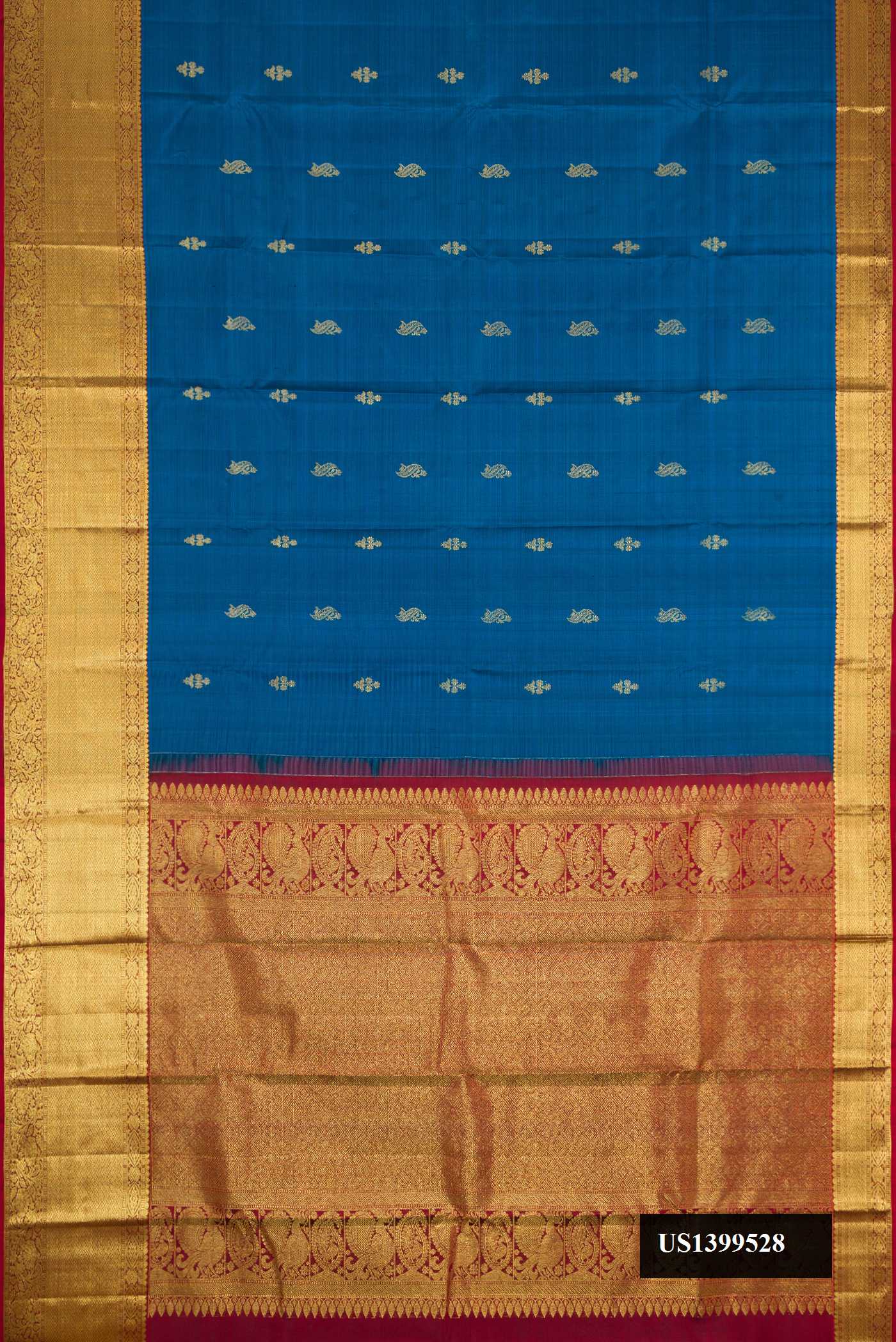 Peacock Blue Dual Tone Kanchipuram Silk Saree with Zari Butta on the body and Zari Border.  displayed on a mannequin