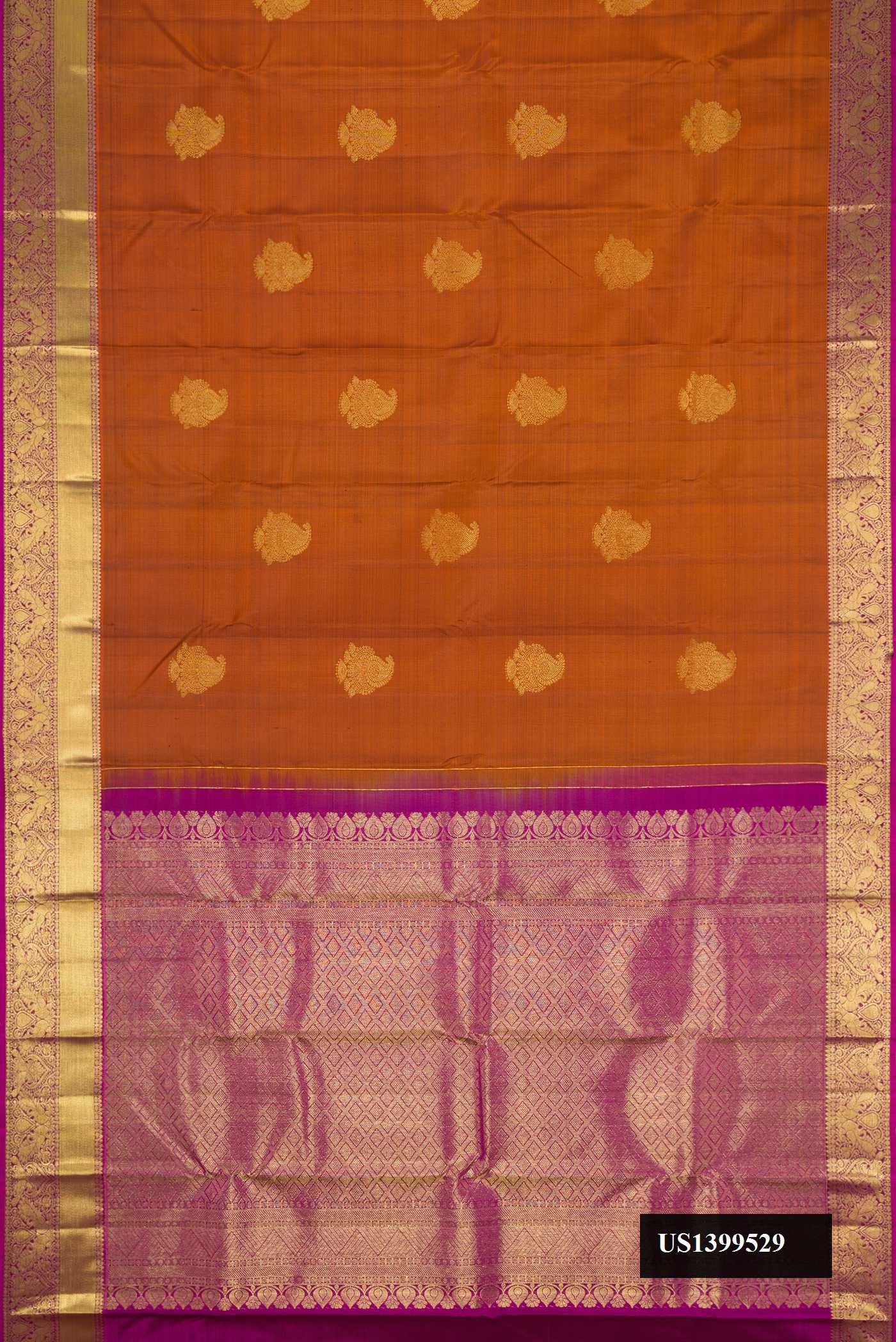 Brick Orange Dual Tone Kanchipuram Silk Saree with Zari Butta on the body and Zari Border.  displayed on a mannequin