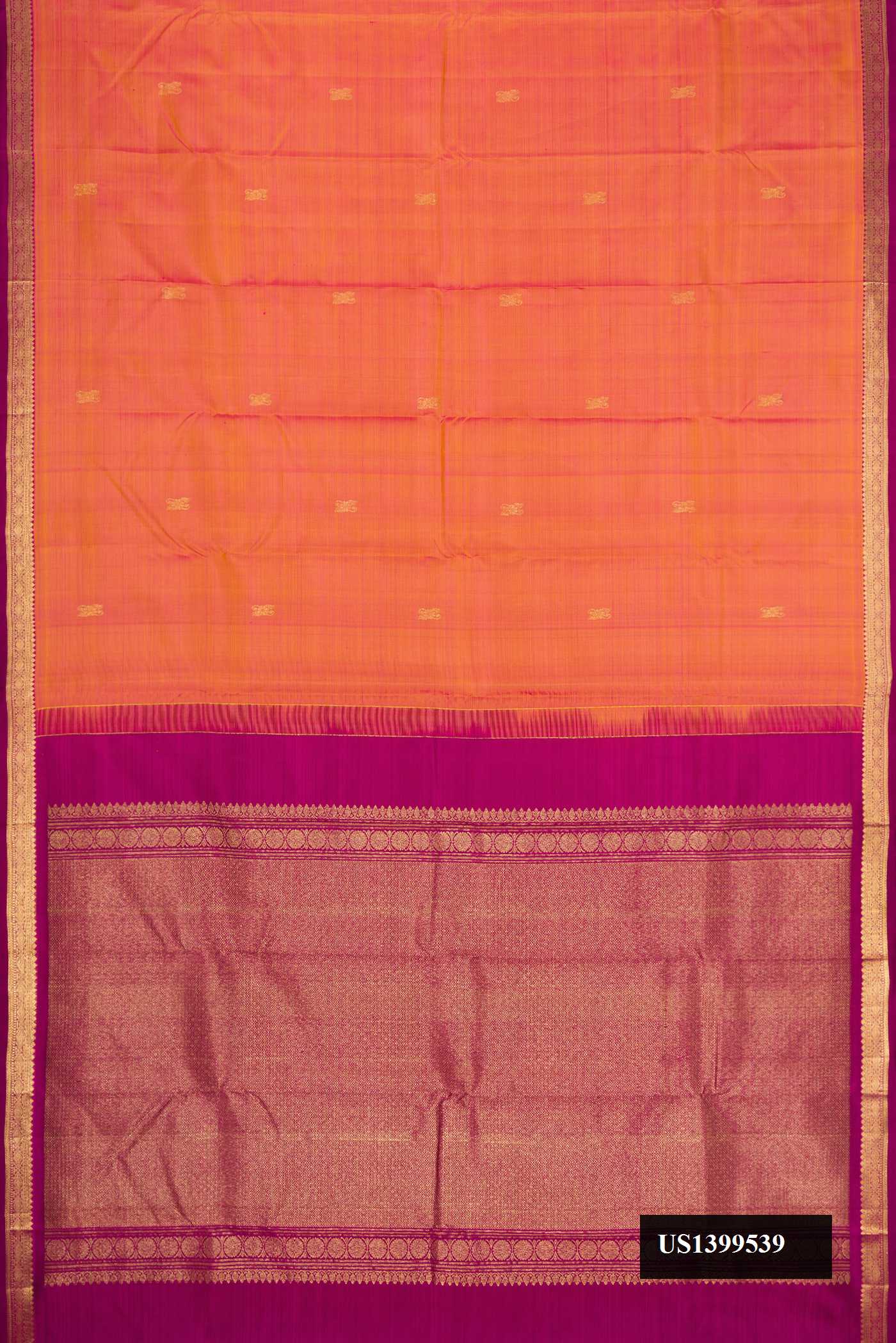 Brick Orange Dual Tone Kanchipuram Silk Saree with Zari Butta on the body and Zari Border.  displayed on a mannequin