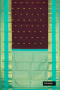Coffee Brown Dual Tone Kanchipuram Silk Saree with Zari Butta on the body and Zari Border.  displayed on a mannequin