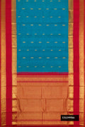 Peacock Blue Dual Tone Kanchipuram Silk Saree with Zari Butta on the body and Zari Border.  displayed on a mannequin