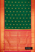 Bottle Green Dual Tone Kanchipuram Silk Saree with Zari Butta on the body and Zari Border.  displayed on a mannequin