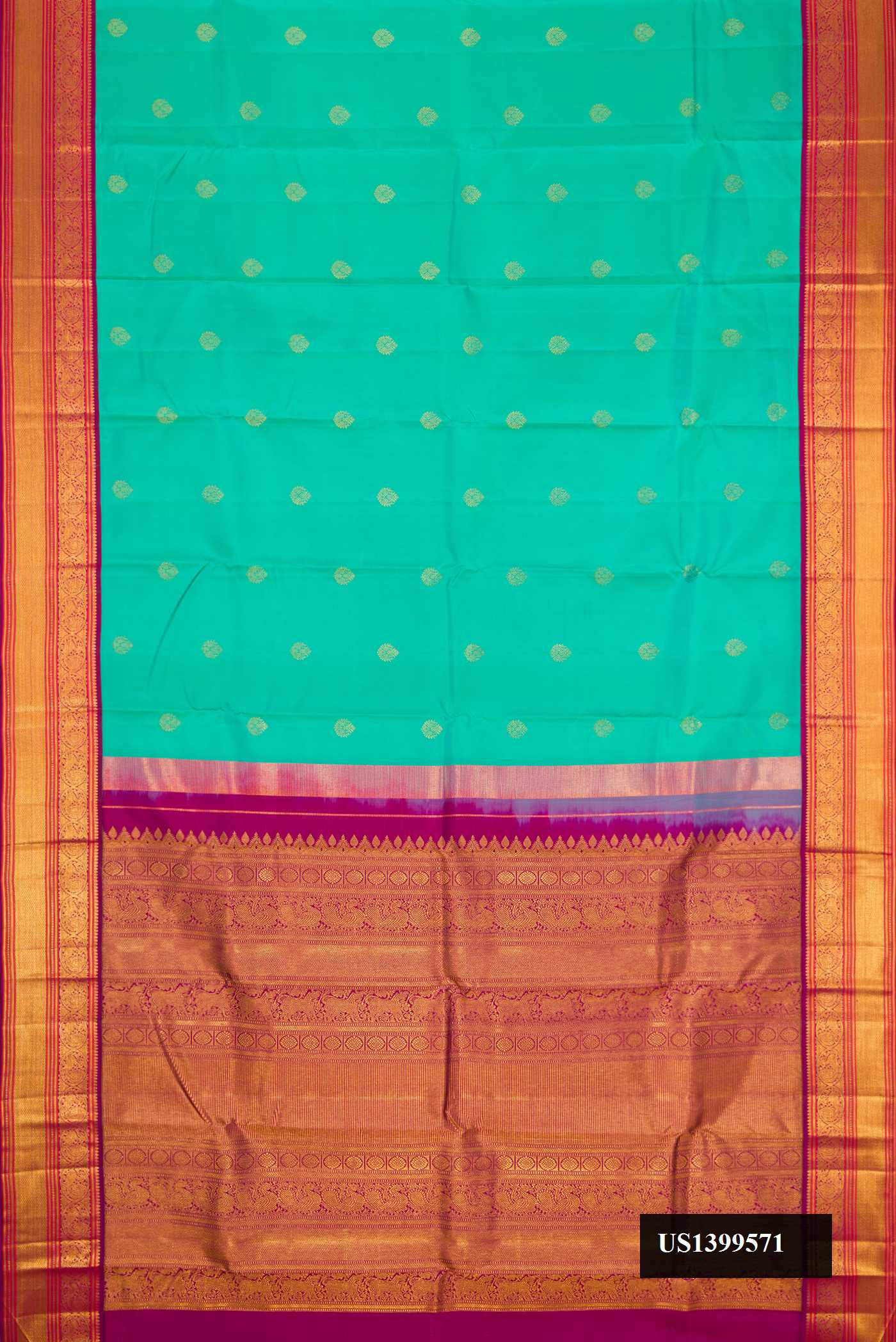 Sea Green Dual Tone Kanchipuram Silk Saree with Zari Butta on the body and Zari Border.  displayed on a mannequin