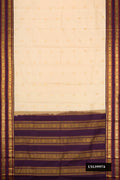 Sandal Dual Tone Kanchipuram Silk Saree with Zari Butta on the body and Zari Border.  displayed on a mannequin