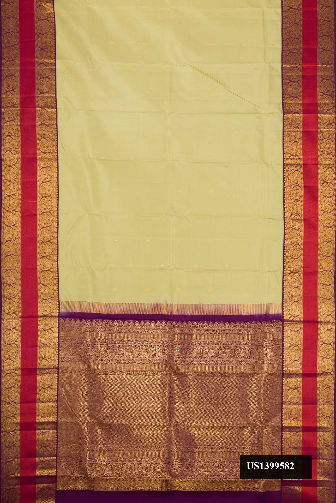 Pista Green Dual Tone Kanchipuram Silk Saree with Zari Butta on the body and Zari Border.  displayed on a mannequin