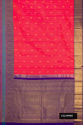 Dark Pink Dual Tone Kanchipuram Silk Saree with Zari Butta on the body and Zari Border.  displayed on a mannequin