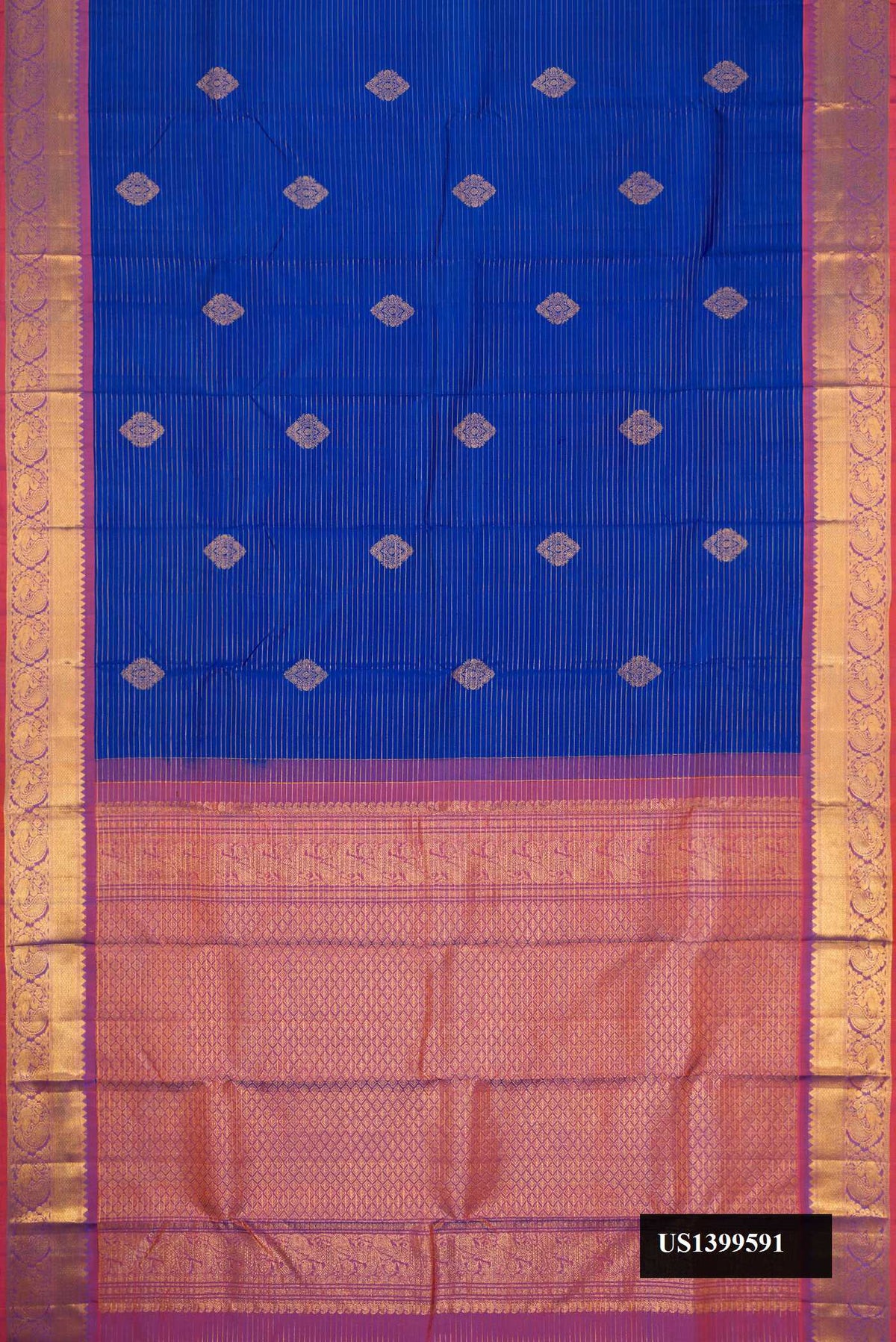 Royal Blue Dual Tone Kanchipuram Silk Saree with Stripes on the body and Zari Border.  displayed on a mannequin