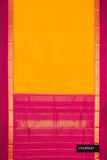 Yellow Dual Tone Kanchipuram Silk Saree with Zari Butta on the body and Zari Border.  displayed on a mannequin