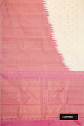 Off White Dual Tone Kanchipuram Silk Saree with Zari Butta on the body and Rising Temple Border.  displayed on a mannequin