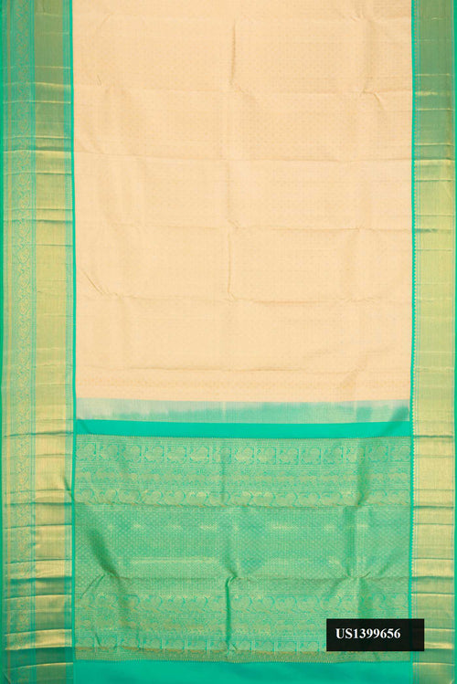 Beige Dual Tone Kanchipuram Silk Saree with Zari Brocade on the body and Zari Border.  displayed on a mannequin