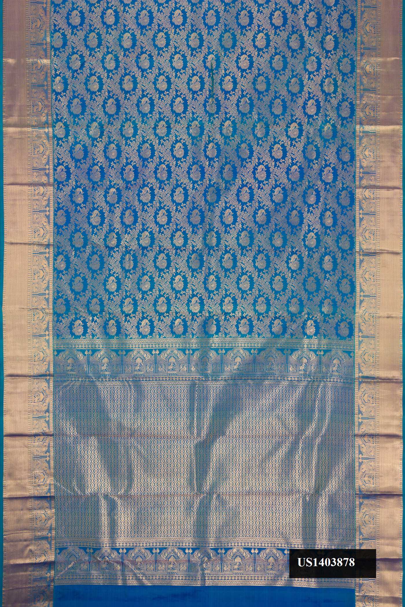 Peacock Blue Dual Tone Kanchipuram Silk Saree with Zari Brocade on the body and Zari Border.  displayed on a mannequin