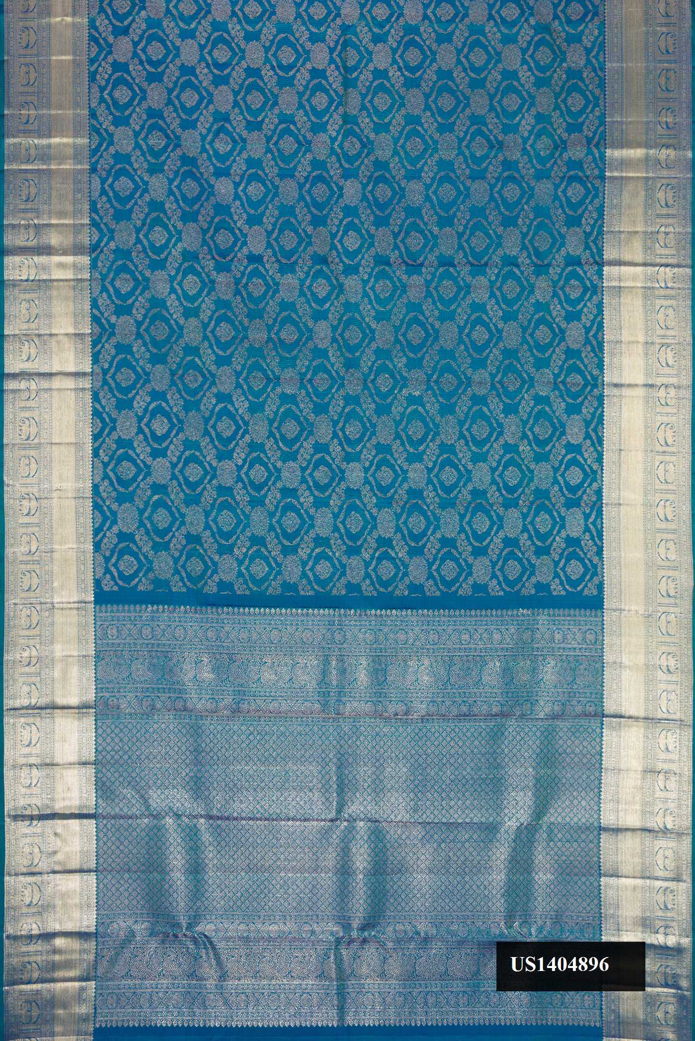 Peacock Blue Dual Tone Kanchipuram Silk Saree with Zari Brocade on the body and Zari Border.  displayed on a mannequin