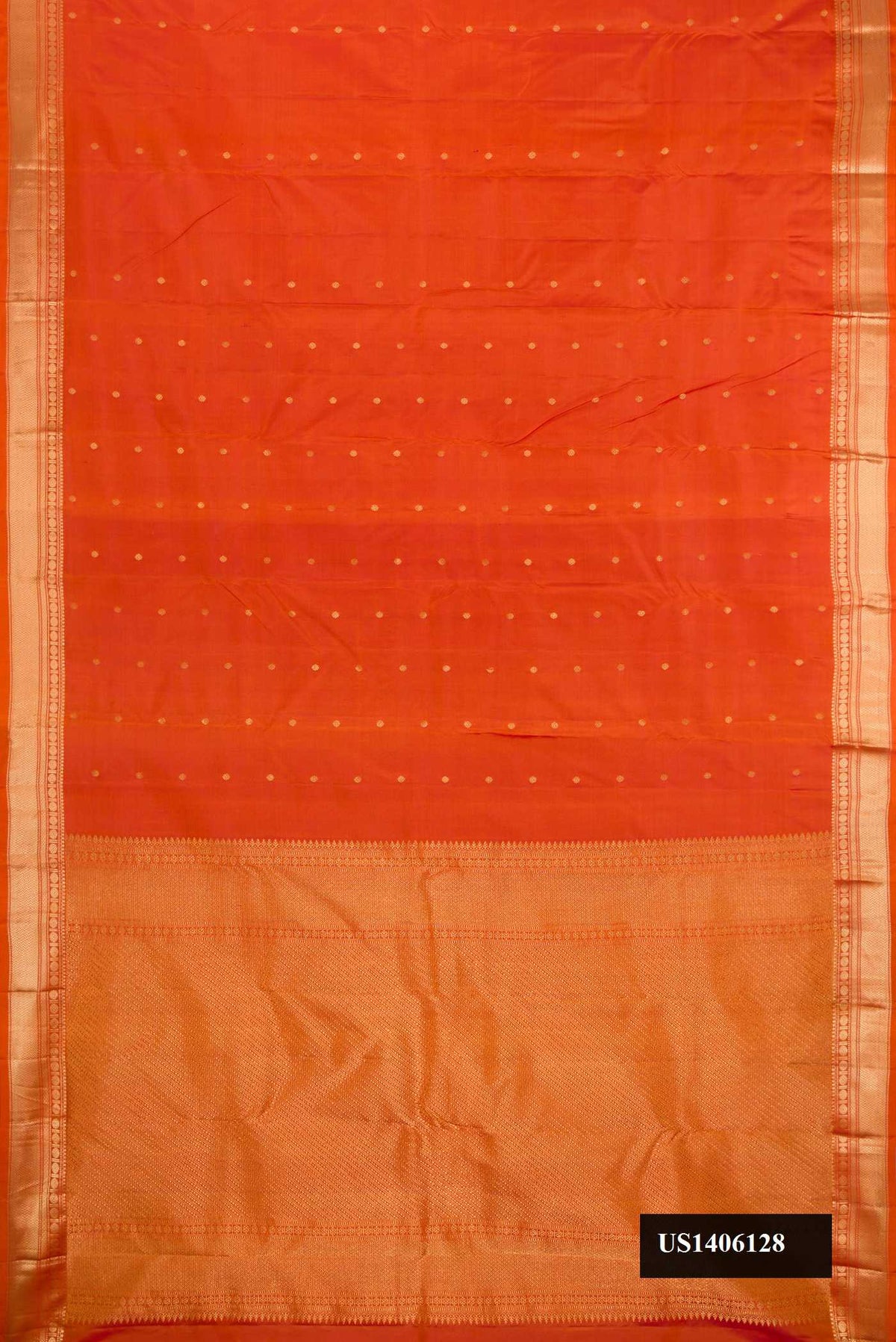 Brick Orange Dual Tone Kanchipuram Silk Saree with Zari Butta on the body and Zari Border.  displayed on a mannequin