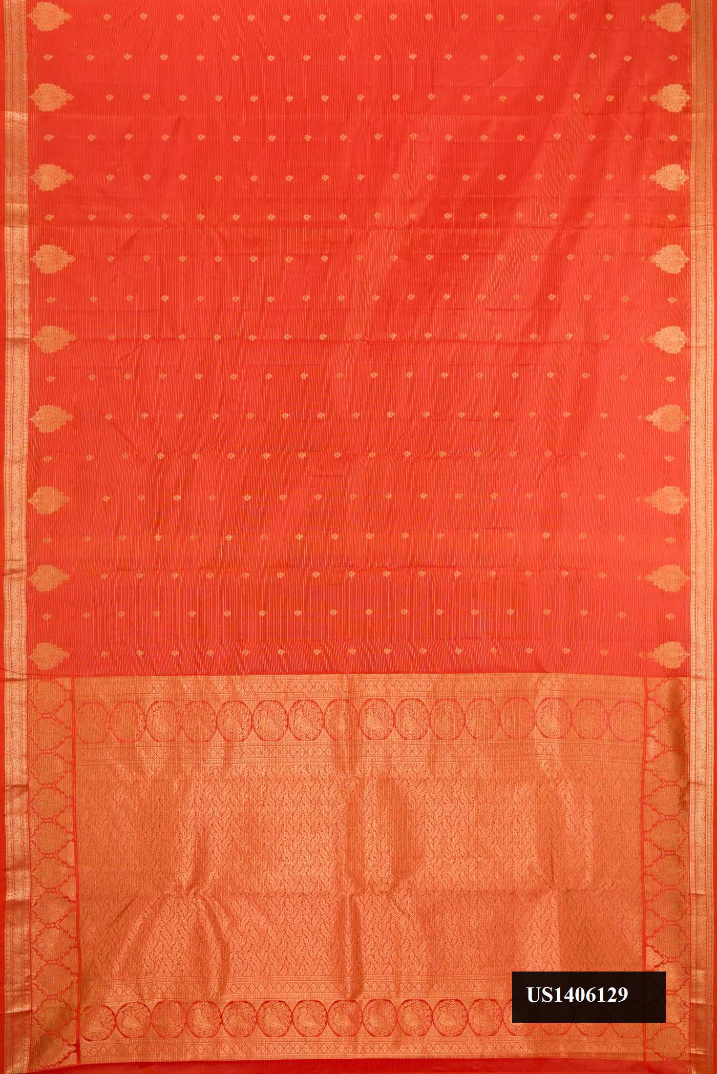 Brick Orange Dual Tone Kanchipuram Silk Saree with Stripes on the body and Zari Border.  displayed on a mannequin