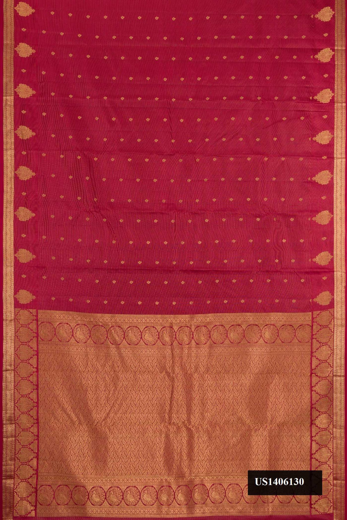 Maroon Dual Tone Kanchipuram Silk Saree with Stripes on the body and Zari Border.  displayed on a mannequin
