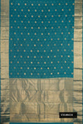 Peacock Blue Dual Tone Kanchipuram Silk Saree with Stripes on the body and Zari Border.  displayed on a mannequin