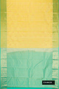 Sandal Dual Tone Kanchipuram Silk Saree with Zari Butta on the body and Zari Border.  displayed on a mannequin