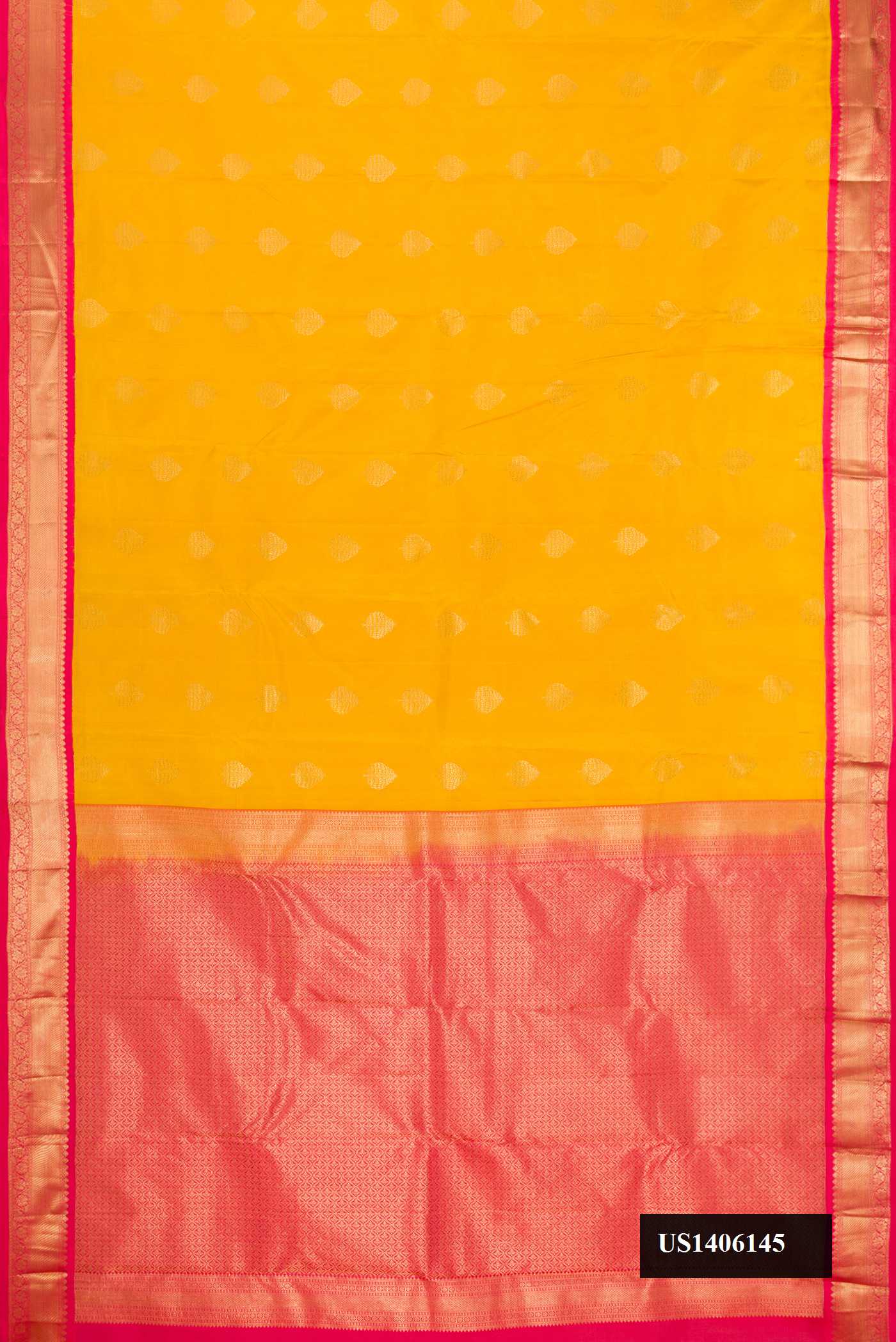 Yellow Dual Tone Kanchipuram Silk Saree with Zari Butta on the body and Zari Border.  displayed on a mannequin