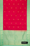 Dark Pink Dual Tone Kanchipuram Silk Saree with Zari Butta on the body and Zari Border.  displayed on a mannequin