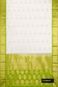 White Dual Tone Kanchipuram Silk Saree with Zari Butta on the body and Zari Border.  displayed on a mannequin