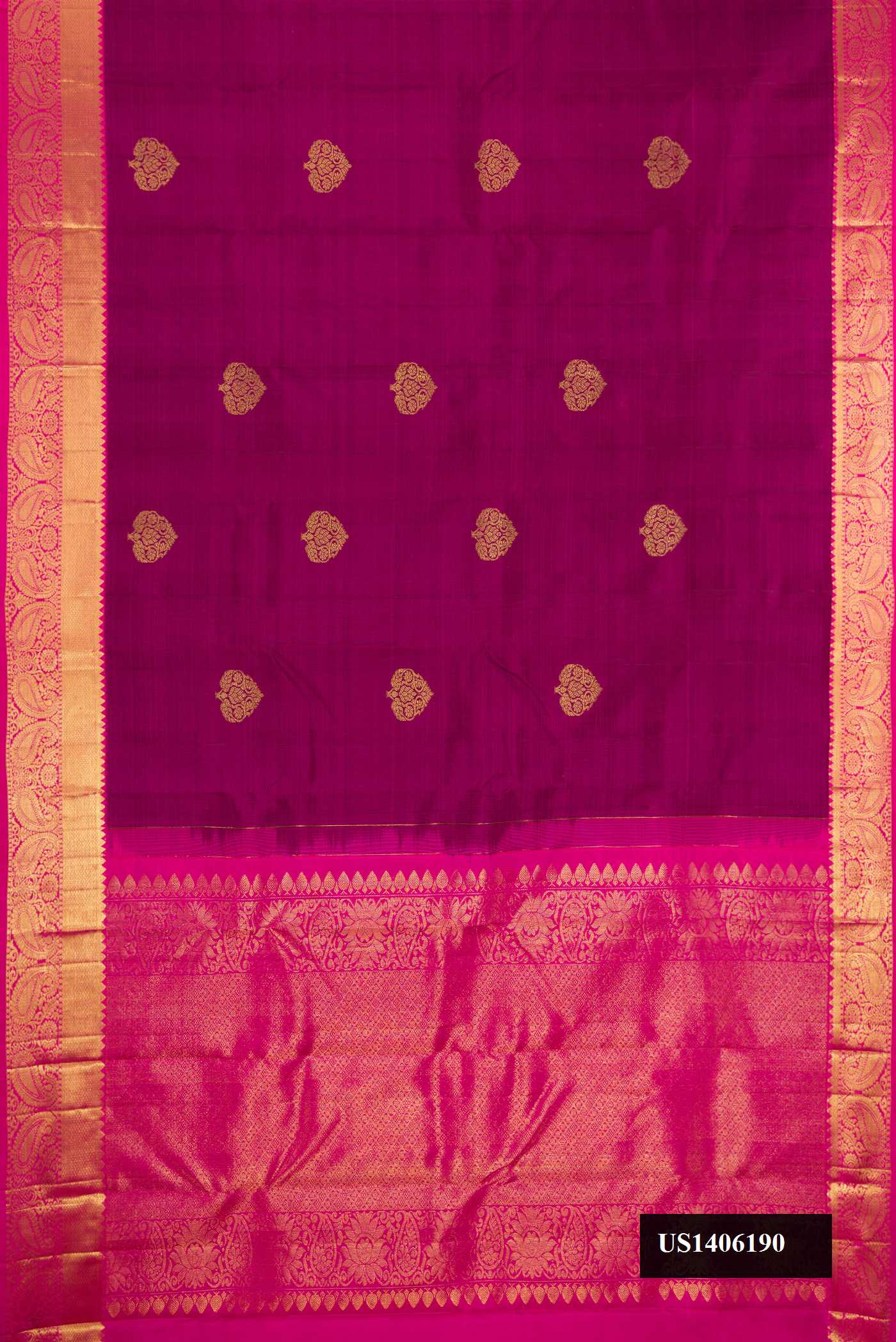 Magenta Dual Tone Kanchipuram Silk Saree with Zari Butta on the body and Zari Border.  displayed on a mannequin