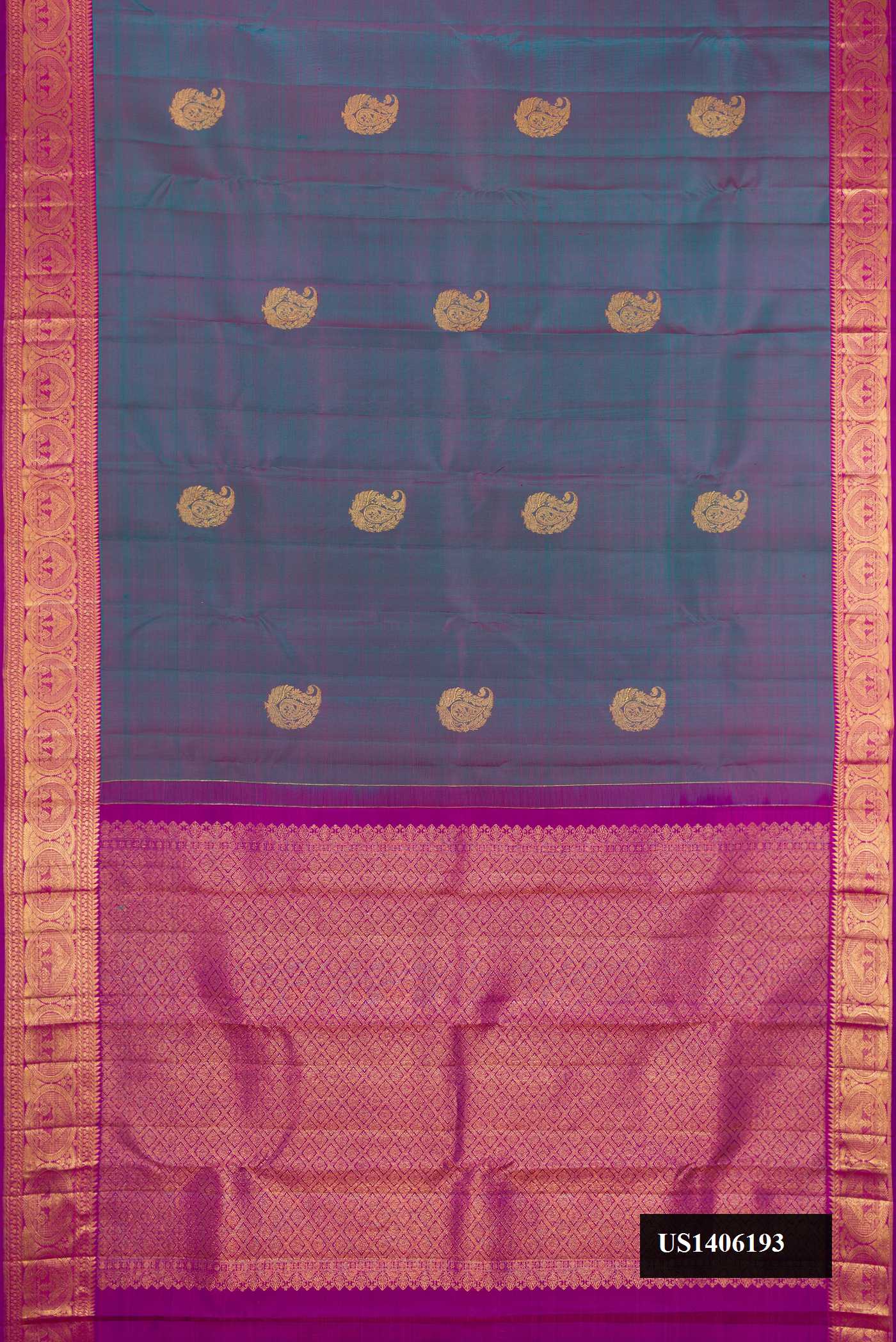 Peacock Blue Dual Tone Kanchipuram Silk Saree with Zari Butta on the body and Zari Border.  displayed on a mannequin