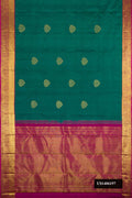 Green Dual Tone Kanchipuram Silk Saree with Zari Butta on the body and Zari Border.  displayed on a mannequin