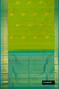 Parrot Green Dual Tone Kanchipuram Silk Saree with Zari Butta on the body and Zari Border.  displayed on a mannequin
