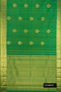 Green Dual Tone Kanchipuram Silk Saree with Zari Butta on the body and Zari Border.  displayed on a mannequin