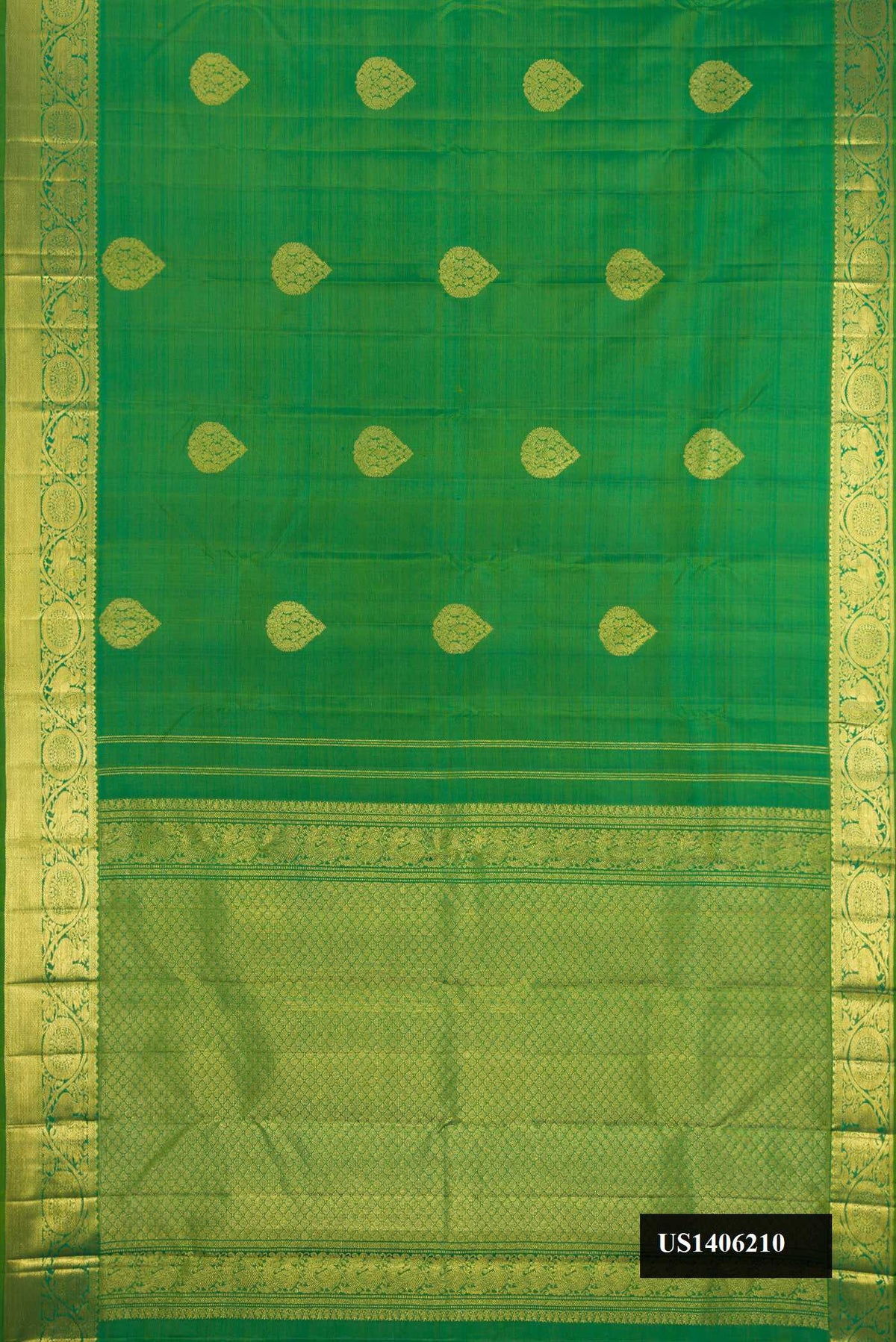 Green Dual Tone Kanchipuram Silk Saree with Zari Butta on the body and Zari Border.  displayed on a mannequin