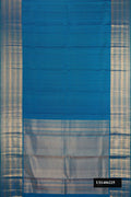 Peacock Blue Dual Tone Kanchipuram Silk Saree with Zari Butta on the body and Zari Border.  displayed on a mannequin
