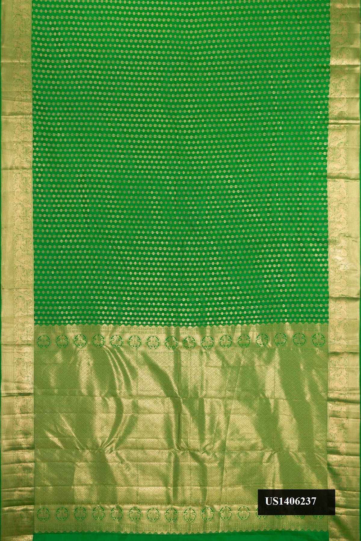 Green Dual Tone Kanchipuram Silk Saree with Zari Butta on the body and Zari Border.  displayed on a mannequin
