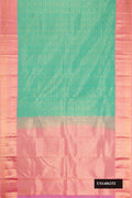 Sea Green Dual Tone Kanchipuram Silk Saree with Zari Brocade on the body and Zari Border.  displayed on a mannequin