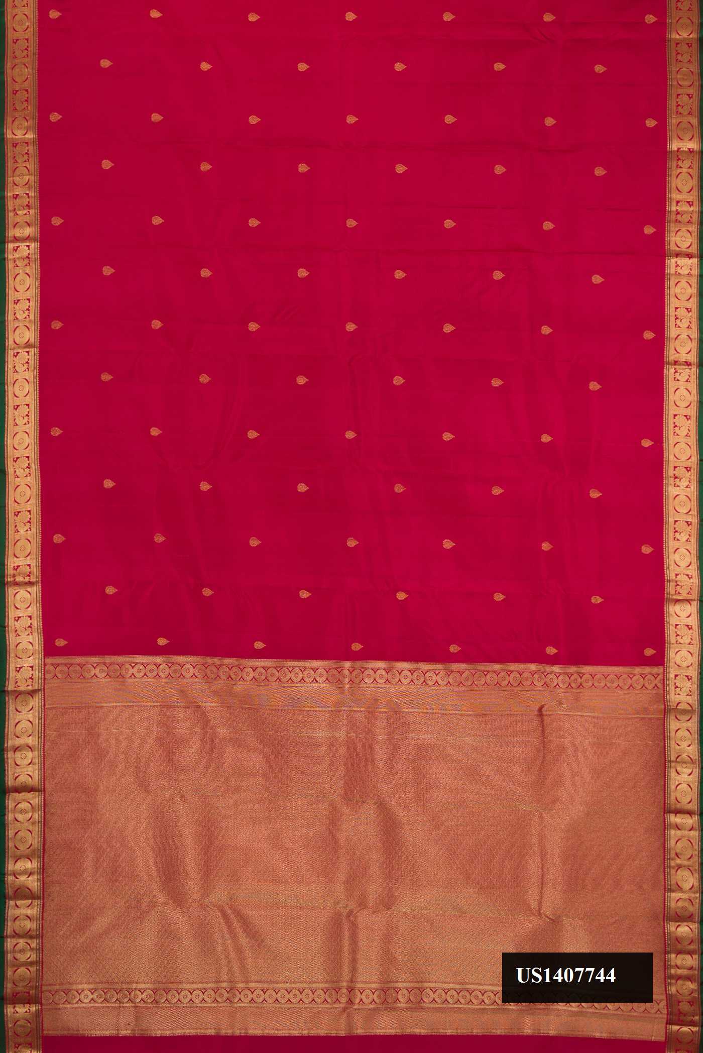 Maroon Dual Tone Kanchipuram Silk Saree with Zari Butta on the body and Zari Border.  displayed on a mannequin