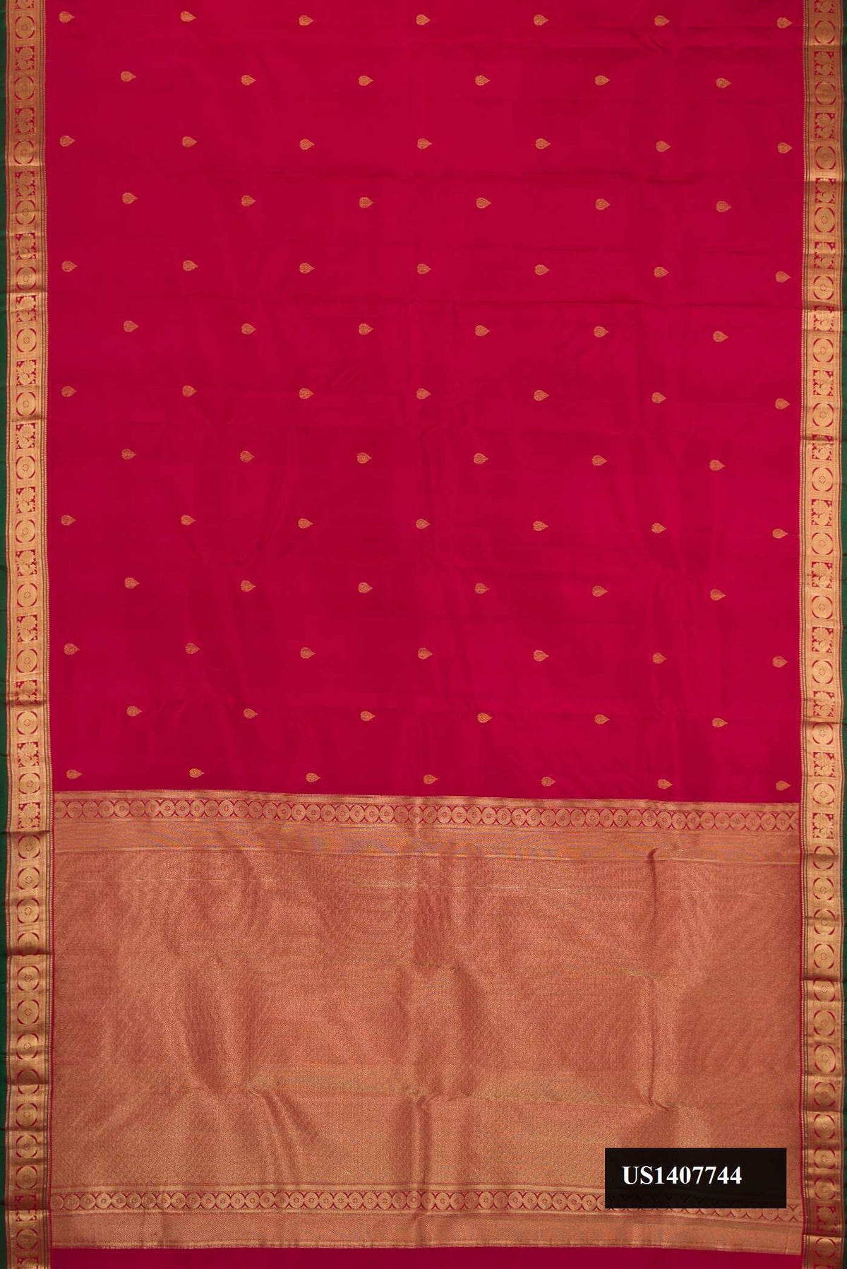 Maroon Dual Tone Kanchipuram Silk Saree with Zari Butta on the body and Zari Border.  displayed on a mannequin