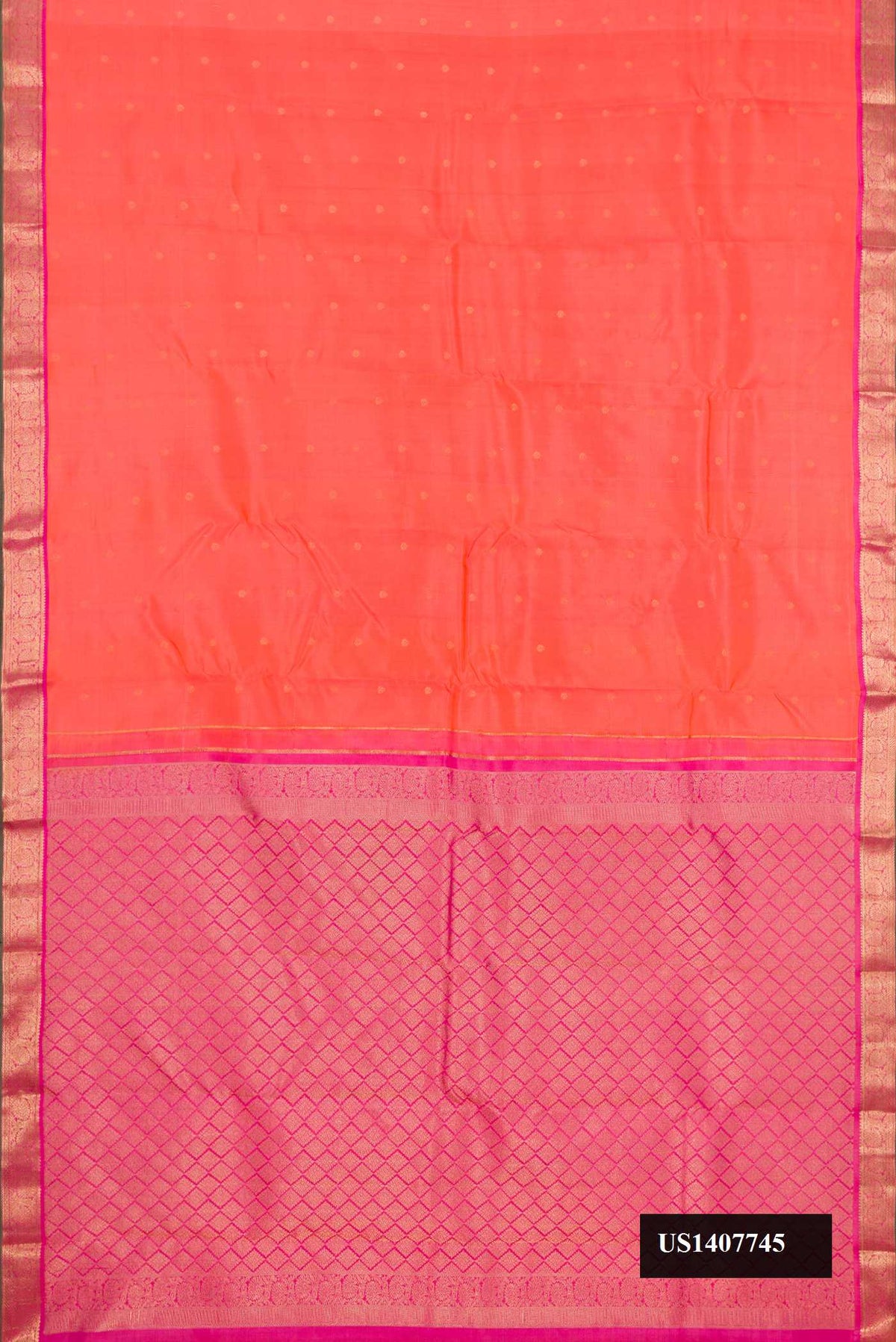 Peach Dual Tone Kanchipuram Silk Saree with Zari Butta on the body and Zari Border.  displayed on a mannequin