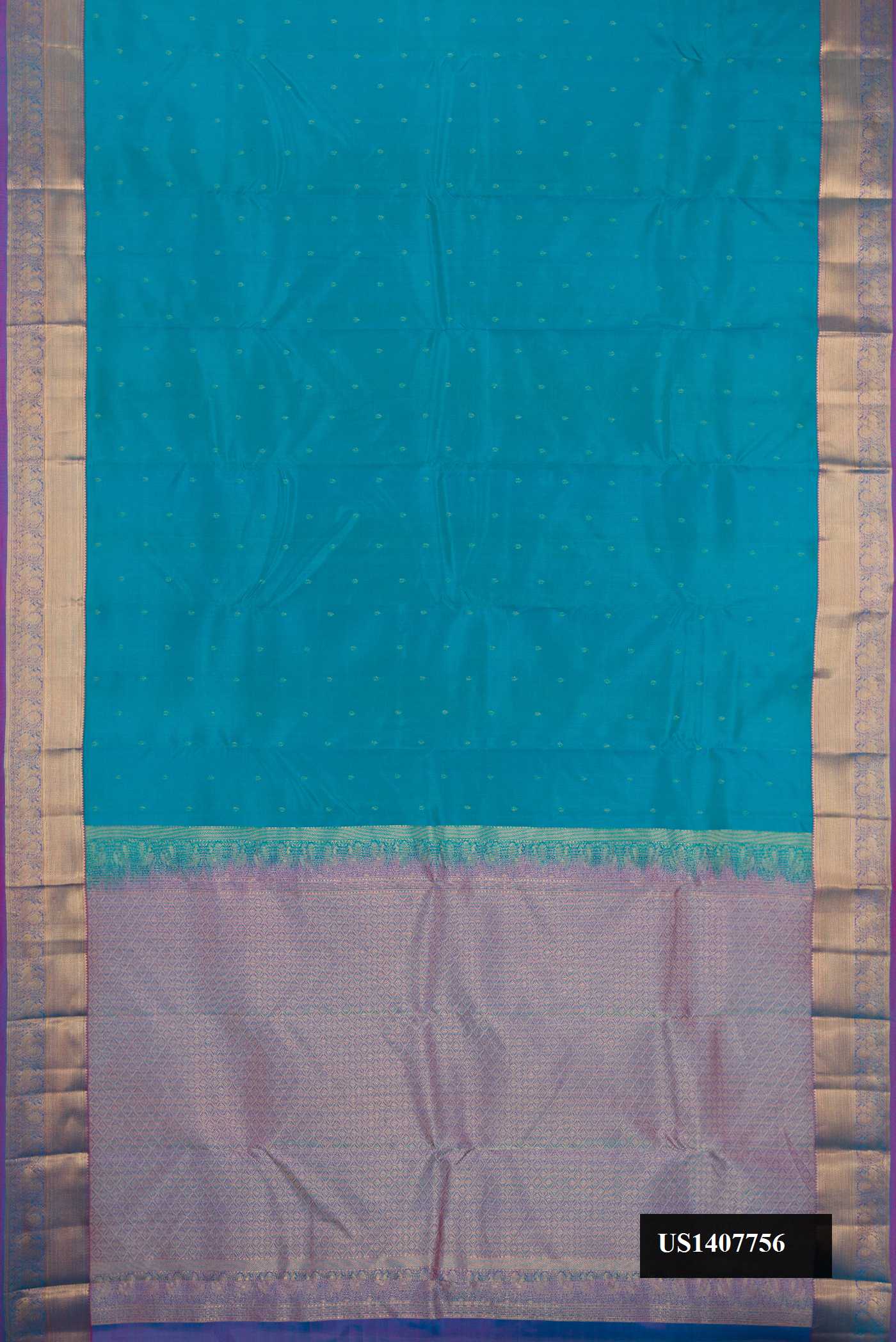 Peacock Blue Dual Tone Kanchipuram Silk Saree with Zari Butta on the body and Zari Border.  displayed on a mannequin