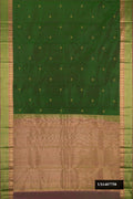 Green Dual Tone Kanchipuram Silk Saree with Zari Butta on the body and Zari Border.  displayed on a mannequin