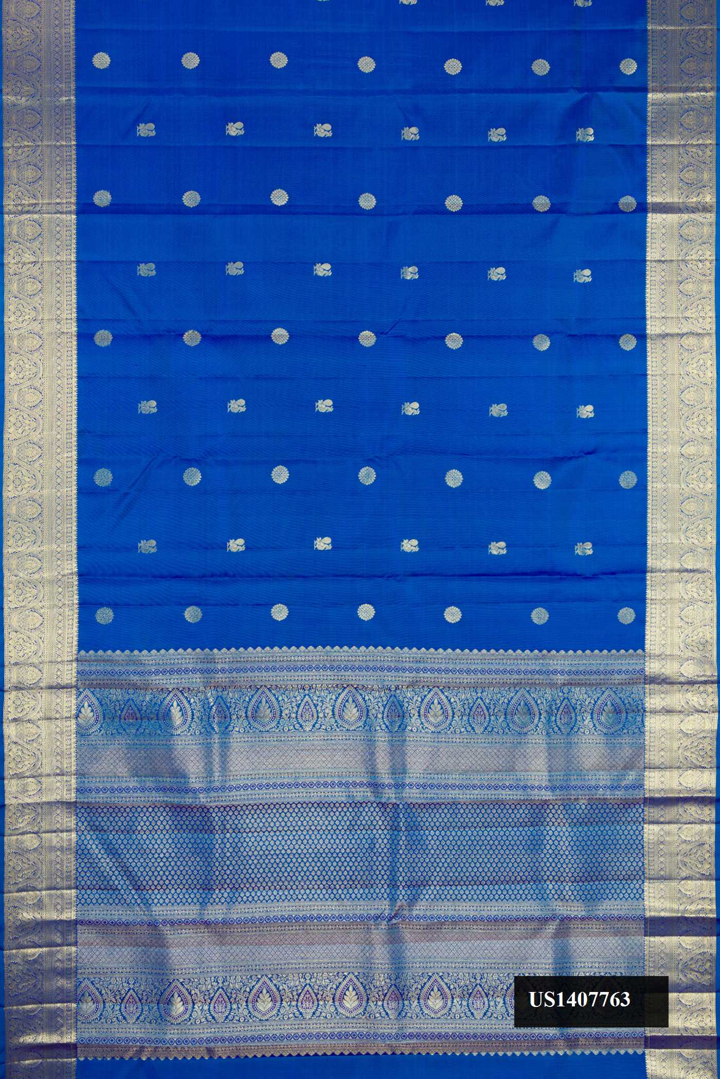Peacock Blue Dual Tone Kanchipuram Silk Saree with Zari Butta on the body and Zari Border.  displayed on a mannequin