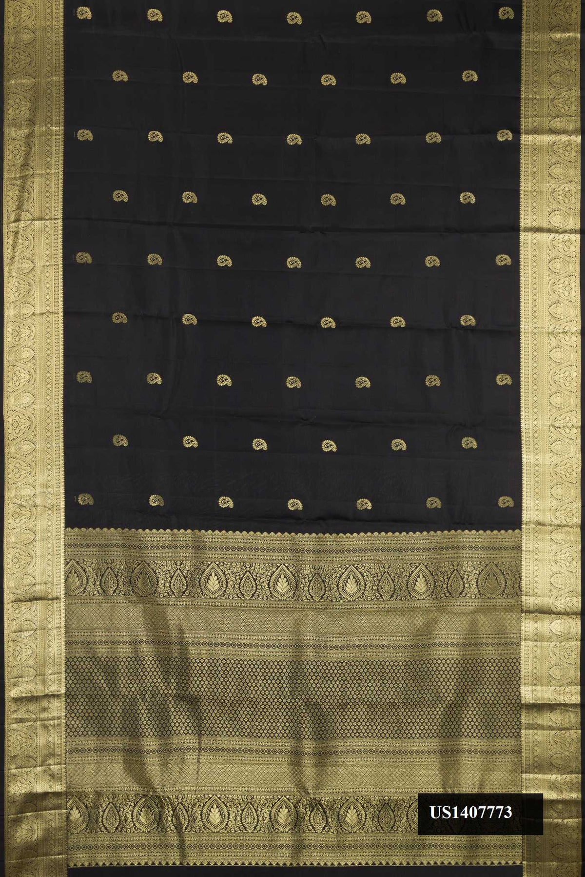 Black Dual Tone Kanchipuram Silk Saree with Zari Butta on the body and Zari Border.  displayed on a mannequin