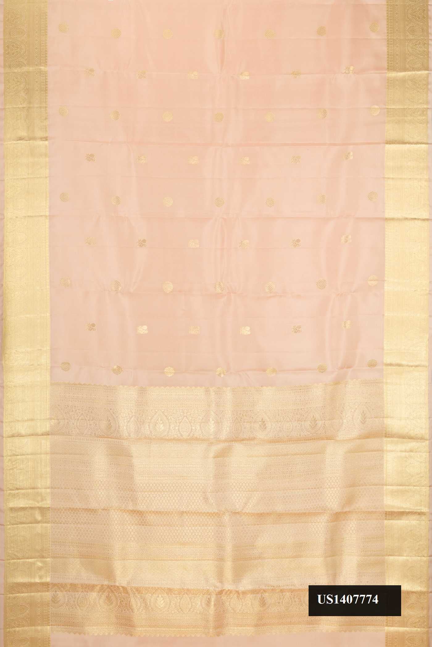 Beige Dual Tone Kanchipuram Silk Saree with Zari Butta on the body and Zari Border.  displayed on a mannequin
