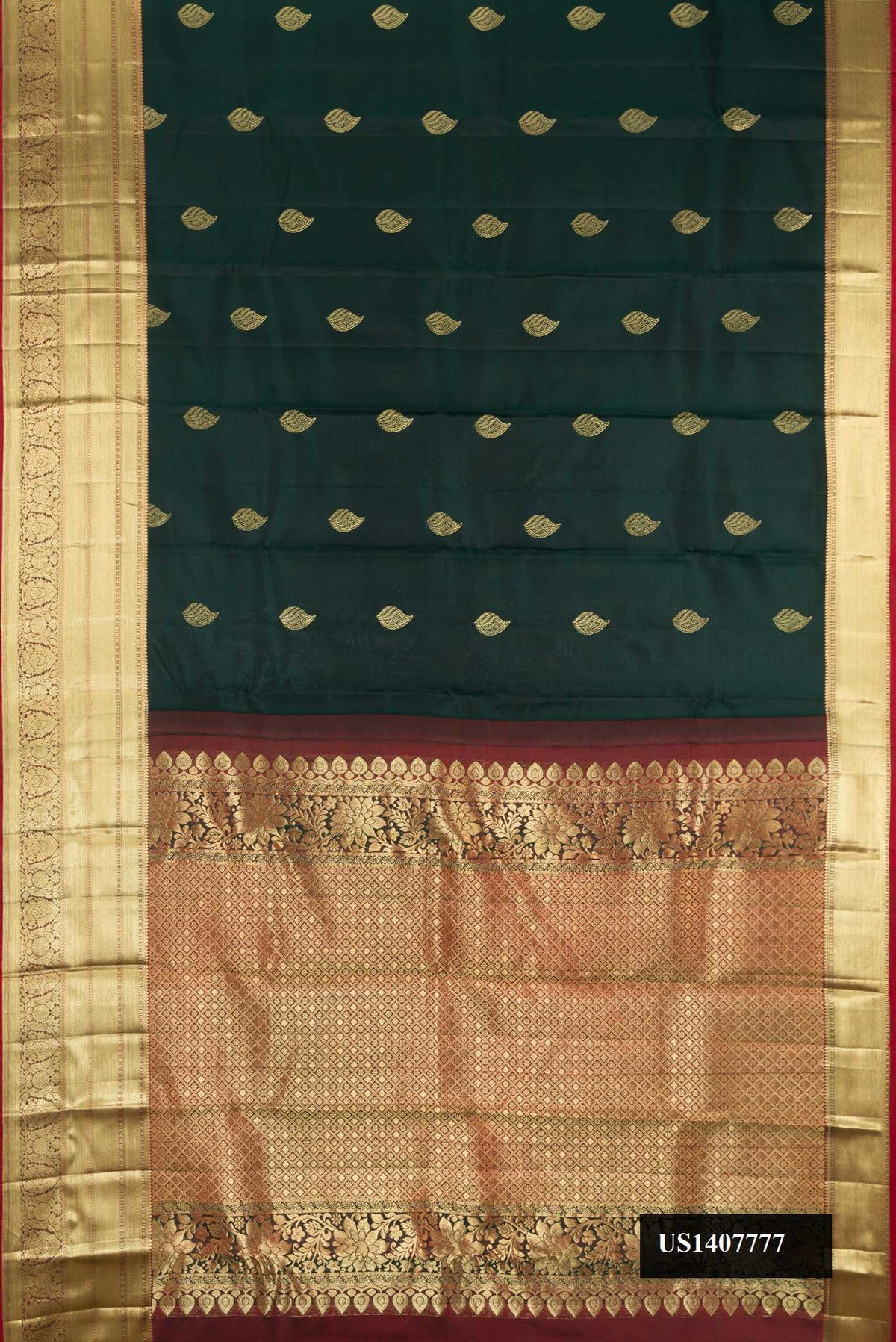 Bottle Green Dual Tone Kanchipuram Silk Saree with Zari Butta on the body and Zari Border.  displayed on a mannequin