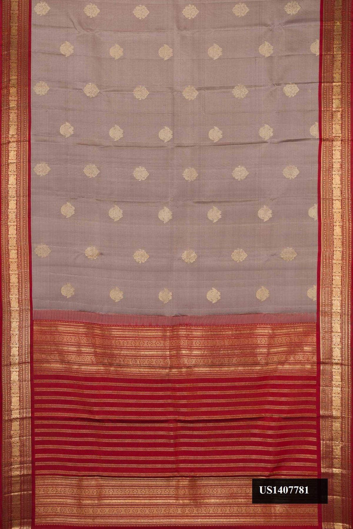 Grey Dual Tone Kanchipuram Silk Saree with Zari Butta on the body and Zari Border.  displayed on a mannequin