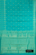 Sea Green Dual Tone Kanchipuram Silk Saree with Zari Butta on the body and Fancy Border.  displayed on a mannequin
