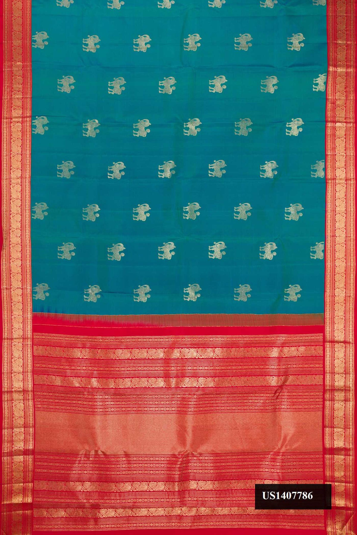 Peacock Blue Dual Tone Kanchipuram Silk Saree with Zari Butta on the body and Zari Border.  displayed on a mannequin