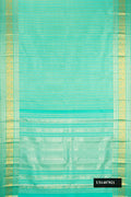 Sea Green Dual Tone Kanchipuram Silk Saree with Zari Brocade on the body and Zari Border.  displayed on a mannequin