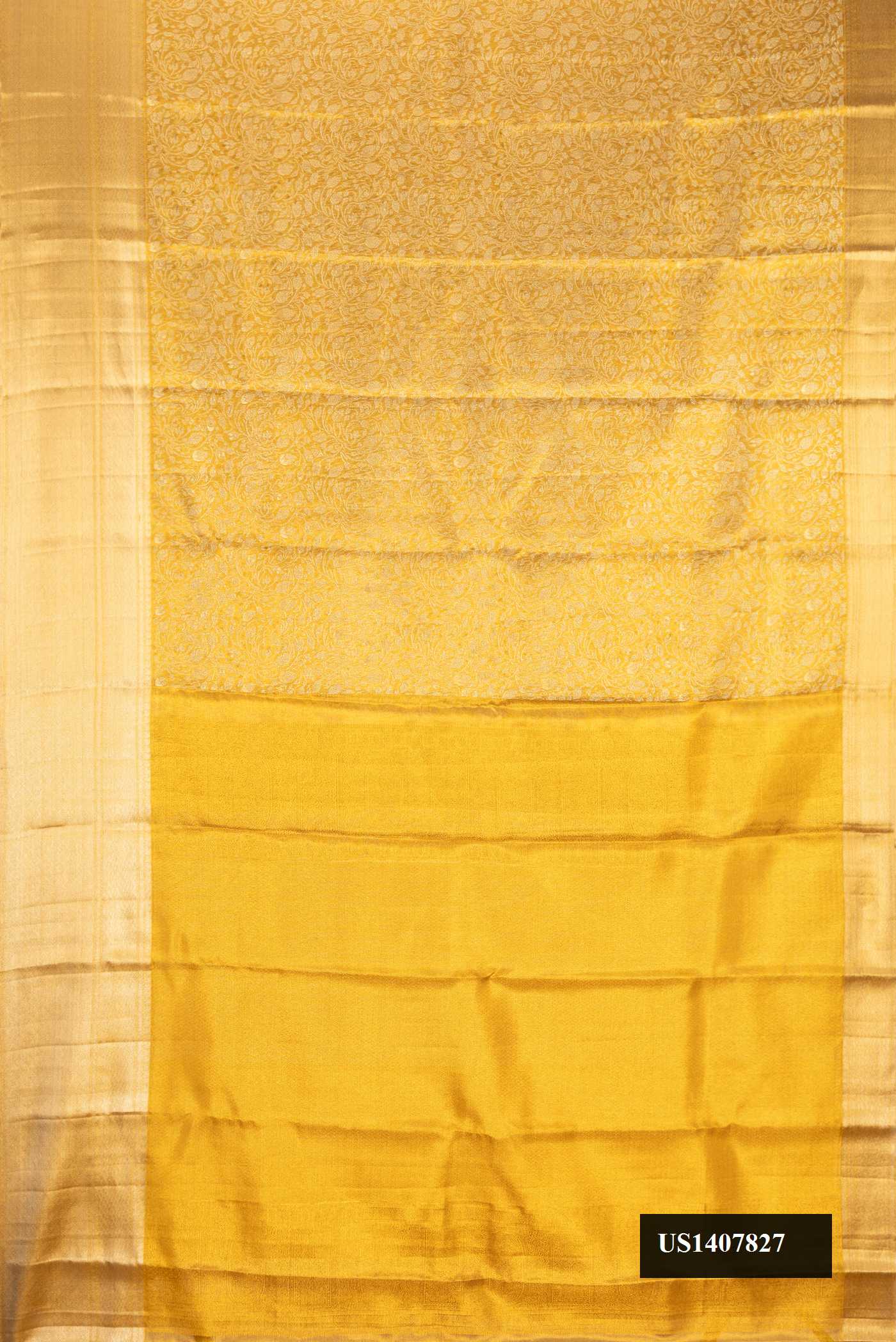 Gold Dual Tone Kanchipuram Tissue Silk Saree with Zari Brocade on the body and Zari Border.  displayed on a mannequin