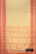 Gold Dual Tone Kanchipuram Tissue Silk Saree with Zari Brocade on the body and Fancy Border.  displayed on a mannequin