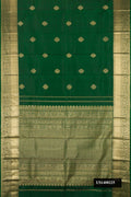 Bottle Green Dual Tone Kanchipuram Silk Saree with Zari Butta on the body and Zari Border.  displayed on a mannequin