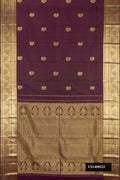 Burgundy Dual Tone Kanchipuram Silk Saree with Zari Butta on the body and Zari Border.  displayed on a mannequin